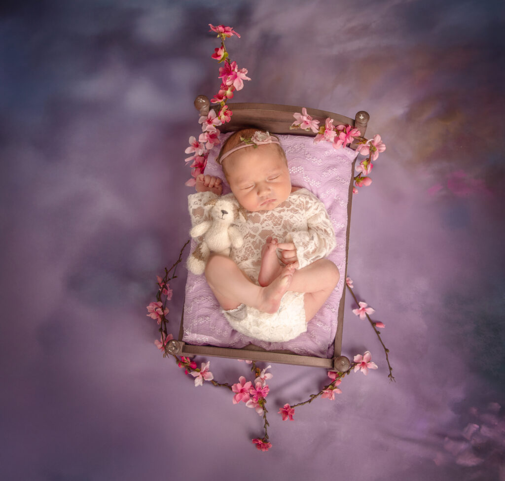 Newborn baby posed in bed setup during Ottawa newborn photo session