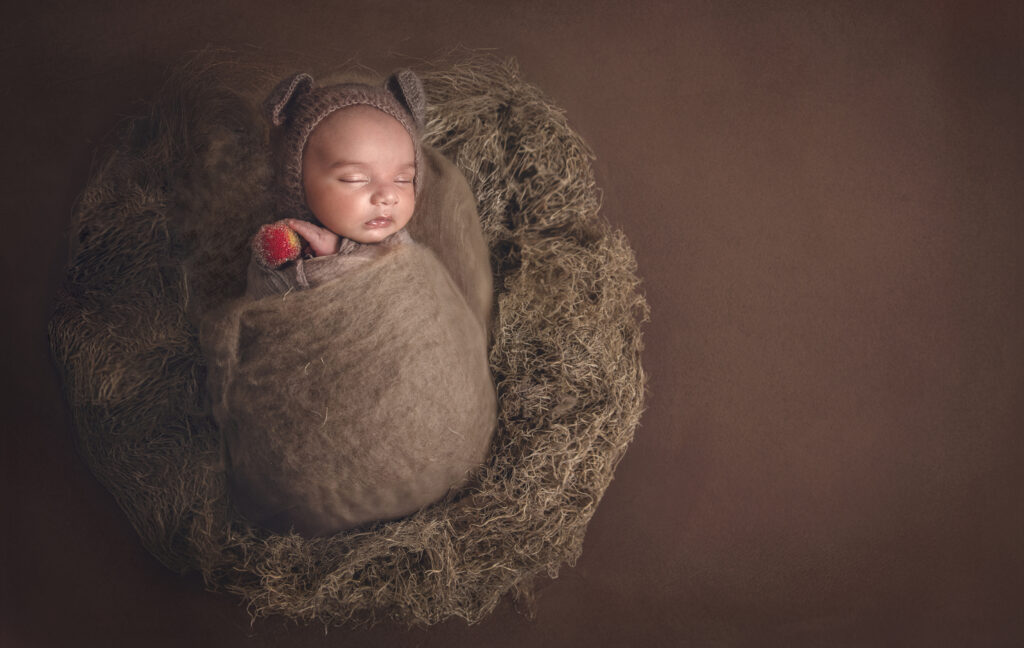 Ottawa newborn photography of baby posed in brown textured wraps