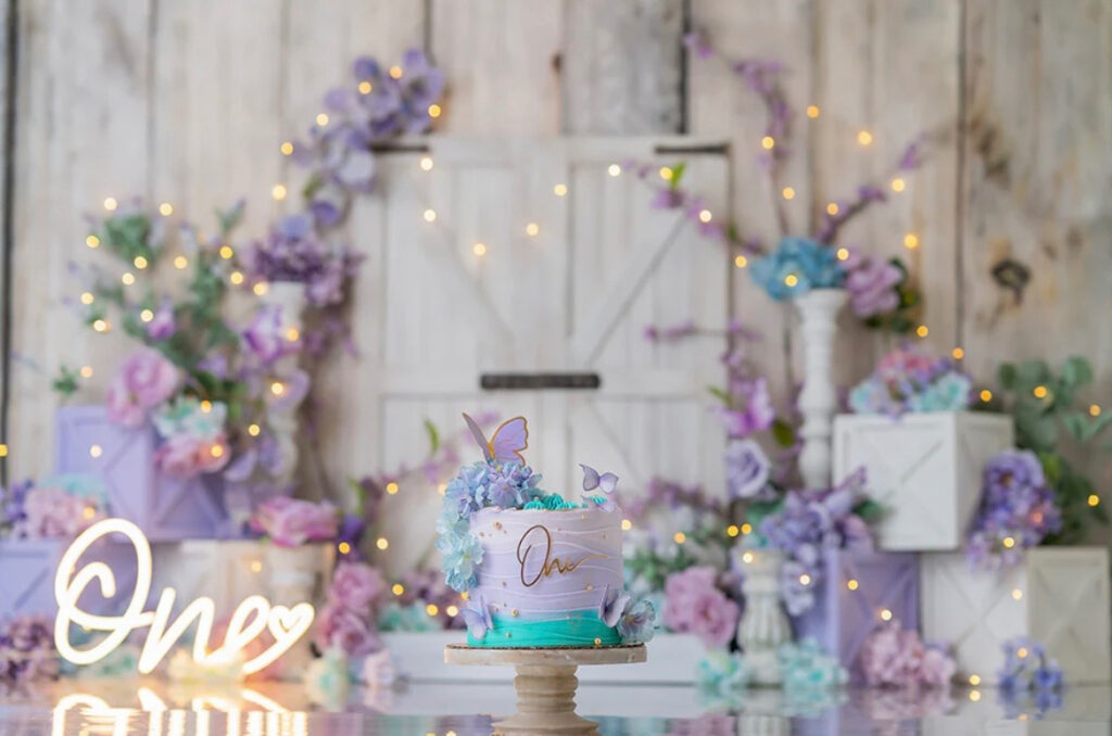 Baby cake smash in lavender butterfly garden Ottawa studio backdrop
