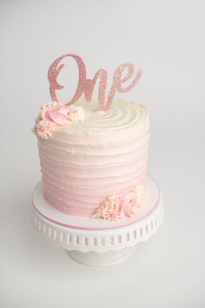 First birthday cake on our Simplicity cake Smash session ln Ottawa background