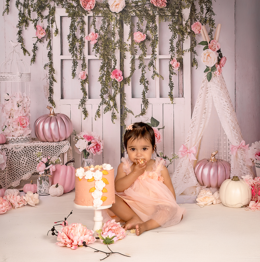 Baby enjoying frosting during playful Ottawa cake smash session