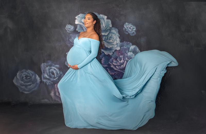Fine art maternity portrait with dramatic lighting created in Ottawa photography studio.