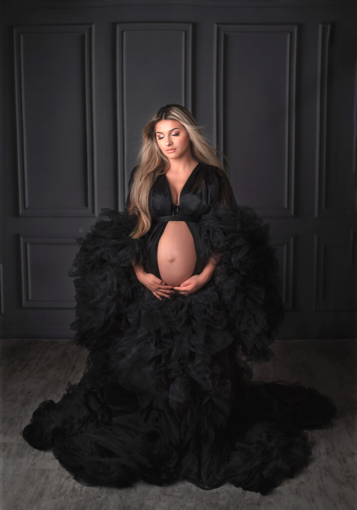 Elegant studio maternity portrait of expecting mother photographed by professional maternity photographer in Ottawa.