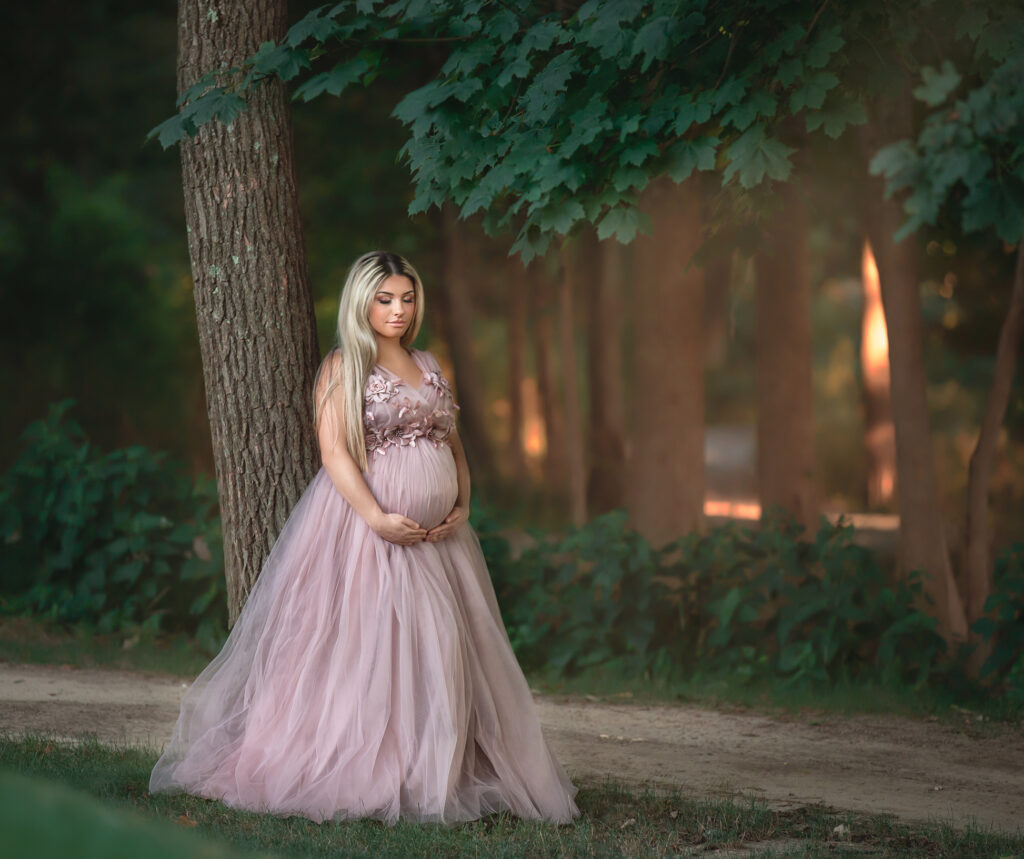 Pregnant mother standing outdoors during golden hour maternity photoshoot in Ottawa.